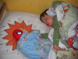 When I checked on him, he had gotten up, brought Spider-Man to bed, and tucked him in.