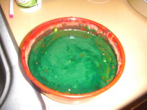 The result of a food-mixing experiment. This is primarily applesauce with food coloring and a few other mysterious ingredients.