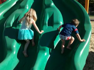The kids took off their pants and shoes so they could use their sticky knees and feet to climb up the slide.
